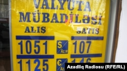 Azerbaijan -- an exchange office sign showing currency exchange rates in Baku - 09Apr2015