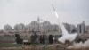 An Iron Dome launcher fires an interceptor rocket near the Israeli city of Ashkelon on November 19.