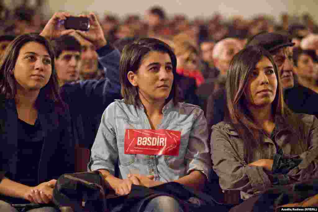 Hasanli's rallies have drawn a wide mix of supporters, from older Azerbaijanis to the very young. Here, a young supporter in Sumgayit wears a sticker bearing Hasanli's campaign slogan -- Basdir!, or "Enough!" 