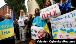 Protesters attend a rally titled "Mariupol Is Ukraine" against Russia's illegal so-called referendums in the parts of Ukraine occupied by Russia, in Kyiv on September 24, 2022.