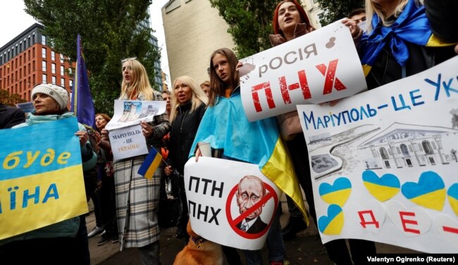 Protesters attend a rally titled "Mariupol Is Ukraine" against Russia's illegal so-called referendums in the parts of Ukraine occupied by Russia, in Kyiv on September 24, 2022.