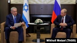 RUSSIA -- Russian President Vladimir Putin (R) meets with Israeli Prime Minister Benjamin Netanyahu in Sochi, August 23, 2017