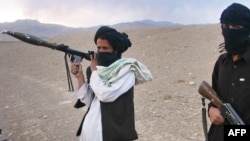 Taliban fighters on a hillside in Maydan Shahr in Wardak Province, west of Kabul, in late September