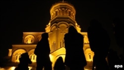 Georgian Orthodox believers walk to the Trinity Cathedral in Tbilisi for Christmas Mass. - Orthodox Christians celebrate Christmas on January 7, in keeping with the traditional Julian calendar, which sets the holiday 13 days later than the more widespread Gregorian calendar.
<br /><br />
Photos by AFP, epa, and RFE/RL