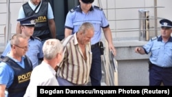 Gheorghe Dinca outside a courthouse in Craiova on July 27.