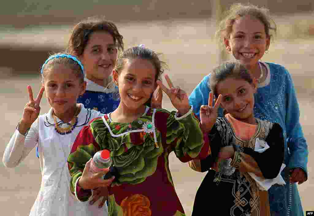 Iraqi children from the village of Al-Khuwayn, south of Mosul, pose for a photo after Iraqi government forces recaptured the village from Islamic State (IS) militants on October 23. (AFP/Ahmad al-Rubaye)