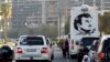 A painting depicting Qatar’s Emir Sheikh Tamim Bin Hamad Al-Thani is seen on a bus during a demonstration in his support in Doha, Qatar, June 11, 2017.