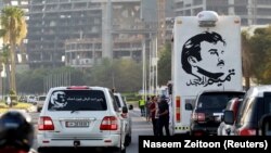 A painting depicting Qatar’s Emir Sheikh Tamim Bin Hamad Al-Thani is seen on a bus during a demonstration in his support in Doha, Qatar, June 11, 2017.