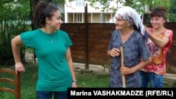 Elizabeth Stone (left) and her biological mother, Liana Khurtsidze, at their Dikhashkho reunion with sister Teona looking on