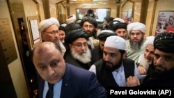 Taliban officials gets into an elevator as they attends the "intra-Afghan" talks in Moscow on February 6.