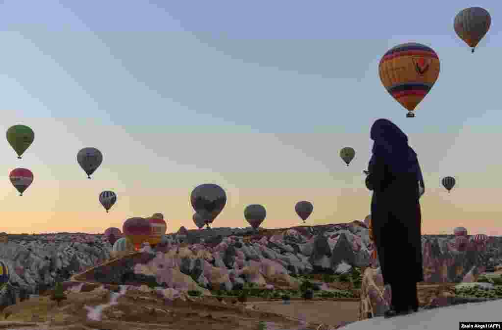 Hot air balloons glide during a flight over Nevsehir in Turkey&#39;s historic Cappadocia region on September 5. (AFP/Yasin Akgul)