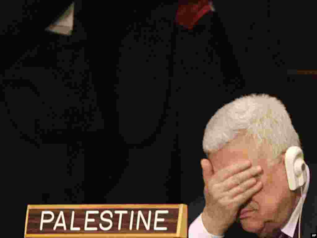 Palestinian leader Mahmud Abbas rubs his eyes during U.S. President Barack Obama's speech at the 66th session of the United Nations General Assembly in New York on September 21. (Photo taken by Seth Wenig for AP)