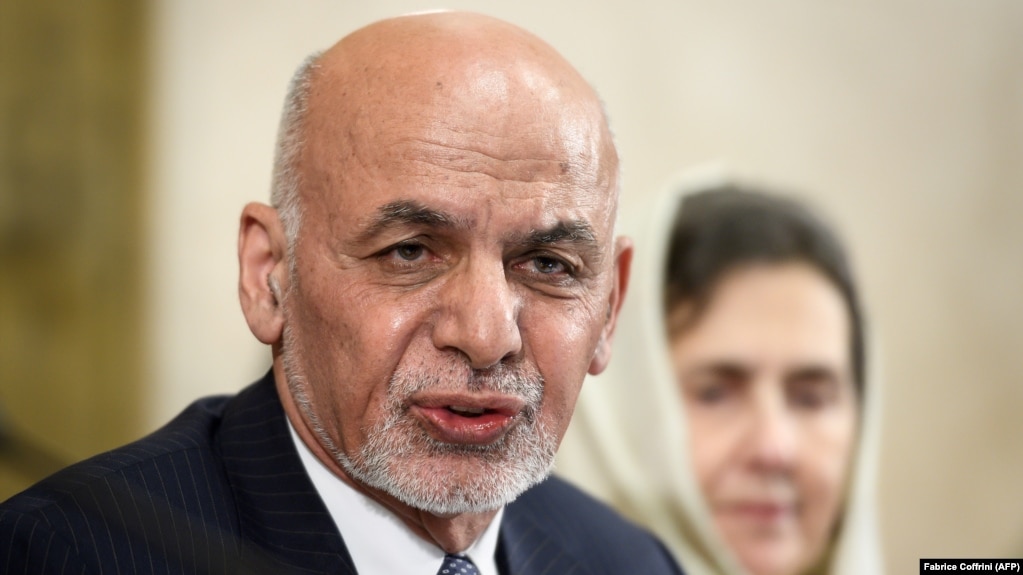 Afghan President Ashraf Ghani delivers a speech next to his wife, Rula, during a United Nations conference on Afghanistan in Geneva on November 28.