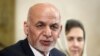 Afghan President Ashraf Ghani delivers a speech next to his wife, Rula Ghani during the United Nations Conference on Afghanistan at the UN Offices in Geneva on November 28.