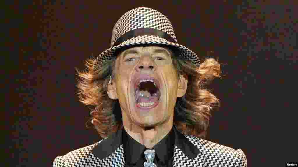 Mick Jagger performs with the Rolling Stones at the O2 Arena in London. The Stones took to the stage on November 25 after a five-year hiatus to celebrate their golden jubilee. Now in their mid-60s to early 70s, lead singer Jagger, guitarists Keith Richards and Ronnie Wood, and drummer Charlie Watts were joined by former members Bill Wyman and Mick Taylor. (Reuters/Toby Melville)