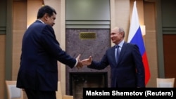 Vladimir Putin (sağda) və Nicolas Maduro dekabrın 5-də Moskvada görüşüblər