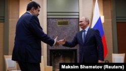 Russian President Vladimir Putin (right) meets with Venezuelan President Nicolas Maduro outside Moscow on December 5.