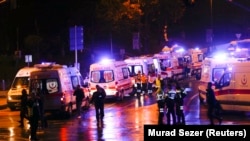 Police and ambulances arrive at the site of an explosion in central Istanbul on December 10.