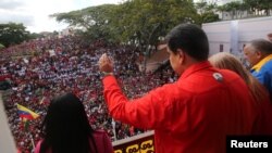 Nicolas Maduro attends a rally in support of his government and to commemorate the 61st anniversary of the end of the dictatorship of Marcos Perez Jimenez in Caracas on January 23.