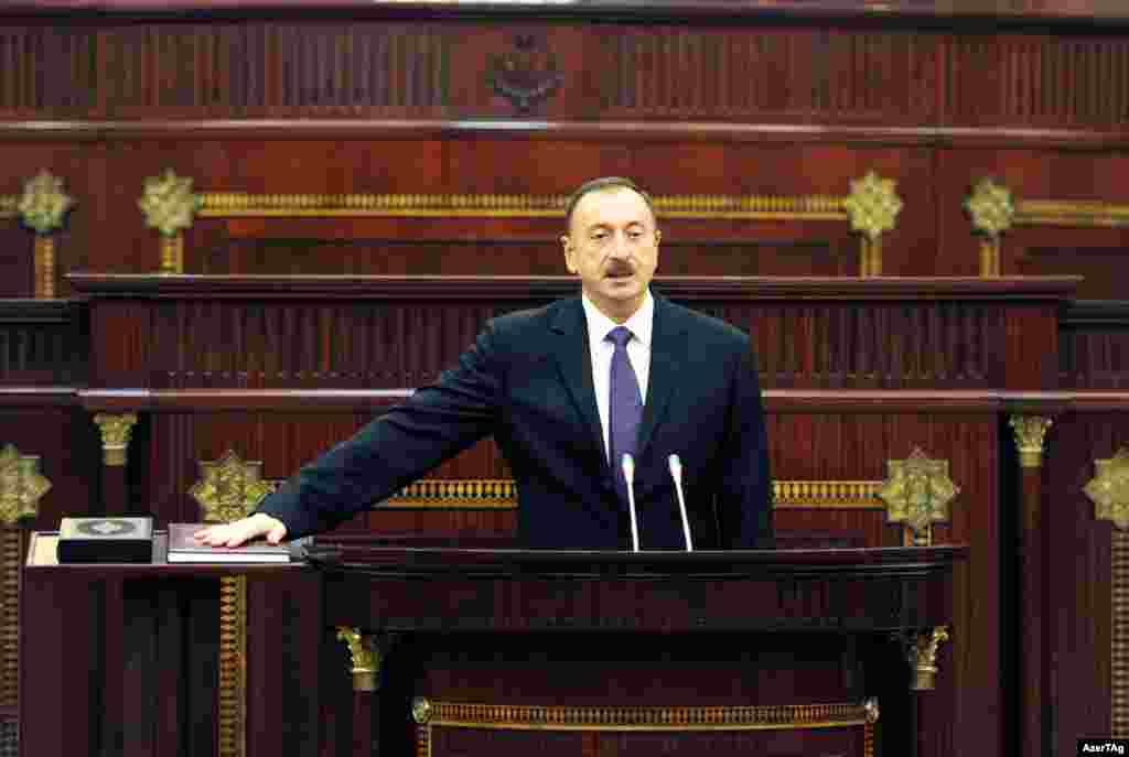 Azerbaijani President Ilham Aliyev is formally sworn in for a third term in Baku on October 19.