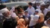 Children who complained of health issues after being administered polio vaccines are rushed to a hospital for treatment in Peshawar, Pakistan, on April 22.