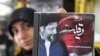 A Lebanese woman shows a CD of Islamic hymns with a cover picture of missing Shi'ite religious leader Musa al-Sadr, who disappeared while on a trip to Libya in 1978.