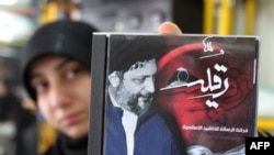 A Lebanese woman shows a CD of Islamic hymns with a cover picture of missing Shi'ite religious leader Musa al-Sadr, who disappeared while on a trip to Libya in 1978.