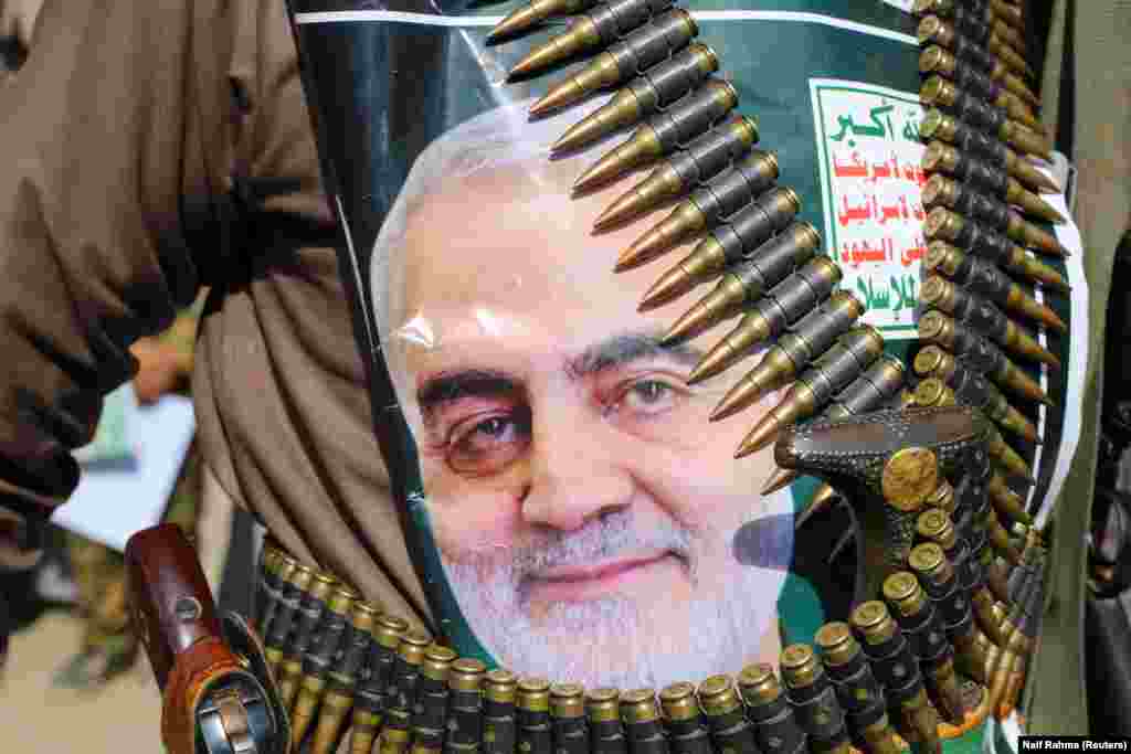 A supporter of the Huthi rebels in Saada, Yemen attached a picture of Soleimani to his clothing. The Iran-backed rebels have called for "swift reprisals" for the killing of the Quds Force commander.