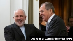 Sergei Lavrov (sağda) və Mohammad Javad Zarif 