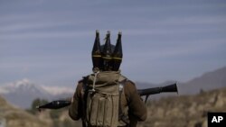 A Pakistani soldier holds a rocket launcher while securing the area in the Bajur tribal region on the border with Afghanistan. (file photo)