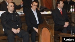 Three defendants in the murder trial of Umar Israilov sit in court in Vienna in November 2010. Prosecutors have linked the suspects to Chechnya's leadership.