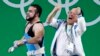 Nijat Rahimov (L) of Kazakhstan celebrates with a member of the coaching staff after setting a new world record and winning the gold medal in the men&#39;s weightlifting 77-kilogram category.
