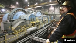 John Pearson, Centerra Gold company's Vice President Investor Relations, looks on at the gold-mining plant at the Kumtor mine.