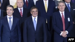 NATO Secretary General Anders Fogh Rasmussen, US Defense Secretary Leon Panetta and Britain's Secretary of Defense Philip Hammond pose for a photo at the NATO Defense Ministers meeting at the NATO headquarter in Brussels