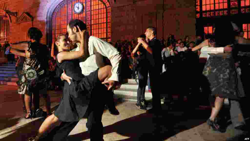 Couples perform the tango during a demonstration at the historic Haydarpasa train station in Istanbul, Turkey. (AFP/Ozan Kose)