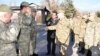 Turkey - Turkish officers (L) greet Armenian colleagues inspecting their army unit near Igdir, 28Nov2012.