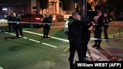 Police man a checkpoint in the Sydney suburb of Surry Hills on July 29 after four people were arrested in a series of raids across the city on July 29.