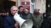 Opposition activists protest outside the de facto parliament of the separatist Georgian entity Abkhazia on January 10. 