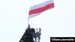 Opposition members fly the flag in Vitebsk.