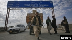 A Pashtun man passes the Pakistani-Afghan border crossing in Chaman, a border that Afghanistan believes is no one's business but the Pashtuns'.