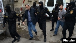 Armenia - Zhirayr Sefilian (L) and another arrested leader of the Founding Parliament movement are taken to the Investigative Committee for further questioning, Yerevan, 9Apr2015.