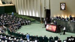 Iranian President Hassan Rouhani (C) delivers a speech to the parliament in Tehran on August 20, 2017, as Iran's parliament prepares to vote on the president's cabinet.