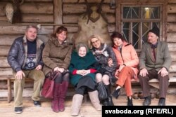 Yanina Grintsevic Stashko (center) with her son Cheslav (left) and other family members in Belarus.