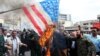 Iranians burn U.S. flag as they take part in an anti-U.S. rally after Friday Prayers to show their support of Iran's revolutionary guards corps (IRGC), in Tehran, April 12, 2019