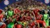 Bayern Munich players celebrate with the trophy after winning the UEFA Champions League final football match between Borussia Dortmund and Bayern Munich at Wembley Stadium in London. (AFP/Christof Stache)