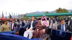 Imran Khan accompanies Prince Muhammad bin Salman on a carriage in Islamabad in February 2019.