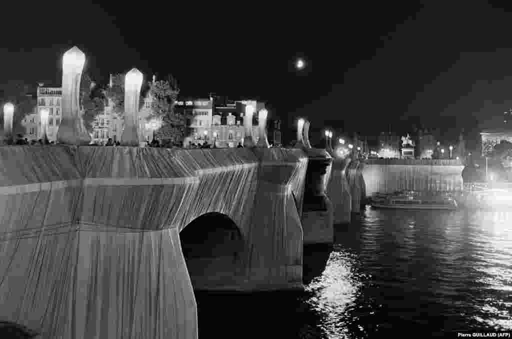 A view by night of the Pont Neuf in Paris, wrapped by Christo