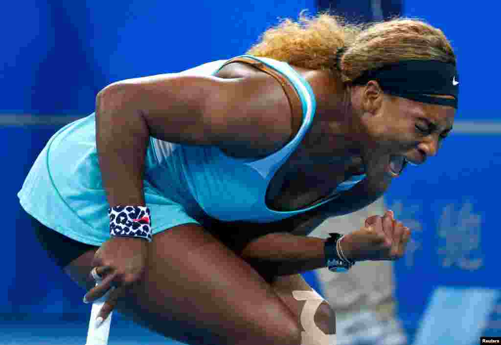 Serena Williams of the United States reacts after winning a point against Lucie Safarova of the Czech Republic during their women's singles match at the China Open tennis tournament in Beijing. Williams beat Safarova in three sets. (Reuters/Petar Kujundzic)