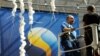 Workers prepare decorations for Swedish presidency in main hall of EU headquarters in Brussels on June 30.