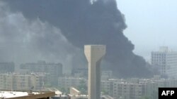 Smoke billows from the site of one of the deadly bombings on August 19. 